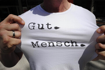 Person wearing a 'Gutmensch' (do gooder) shirt