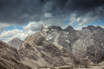 Panorama of the rocky scenario of Cima dei Preti mountain range with dramatic cloudy sky,...