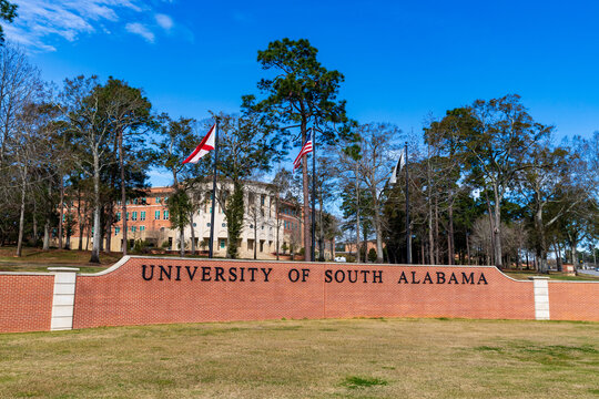 The University of South Alabama sign and flags in Mobile, AL