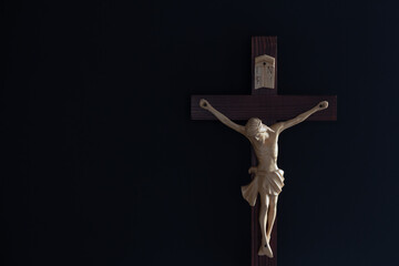 crucifix cross against black background