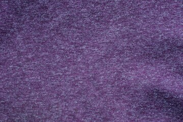 Lilac dark background from a fragment of crumpled fabric clothes