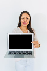 Young woman points her finger at the screen of her laptop