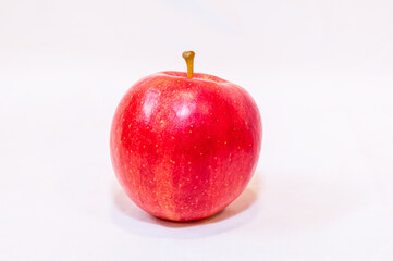 A red and yellow apple on a white background