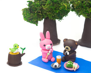 ピクニックをする森の動物たち