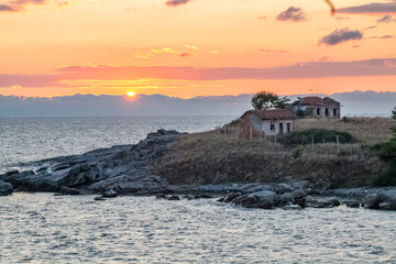 landscape with sunrise on the blach sea - church 