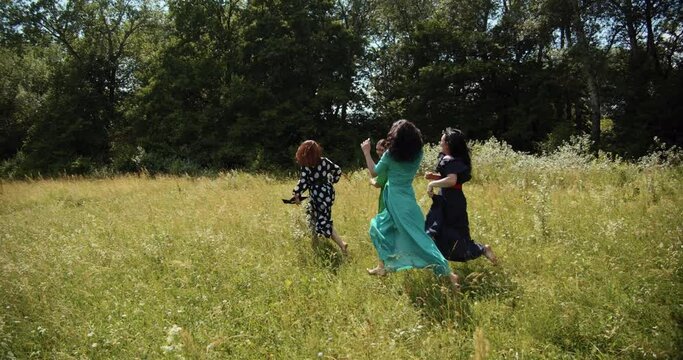  Young girls run, rest and rejoice in the meadow