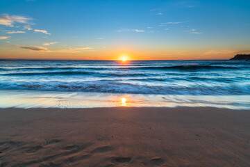 Fototapeta na wymiar South Coast Sunrise Seascape and light high cloud
