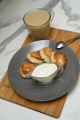 Homemade cheesecakes with cottage cheese, coffee