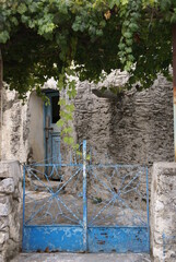 Traditional stone cottage with blue door and gate