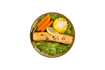 Salmon steak with vegetables, salad, grilled corn, carrot, lemon, pepper, rosemary on isolated white background with clipping path. Top view.
