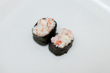 Sushi roll on a white marble background. Japanese food.