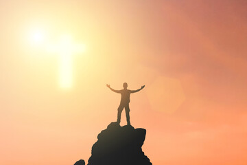 One man Praying for blessings from god During the sunset in the sky the symbol of the cross appeared. Make him feel hopeful And more encouragement