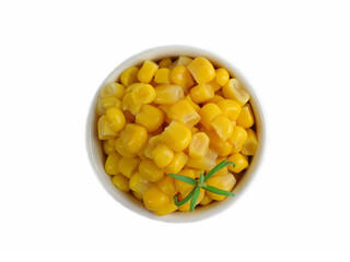 Canned corn in a white dish on a white background.