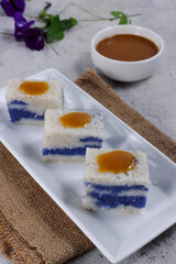 Pulut Tai Tai or pulut tekan or ketan srikaya. Peranakan blue glutinous rice cake with kaya jam or coconut milk jam. 