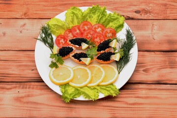 Tartlets with black caviar