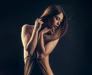 Woman with long hair and naked chest. Hairdresser concept. Woman with very long hair. Beauty hair salon. Haircare and shampoo. Portrait of beauty with beautiful healthy long hair