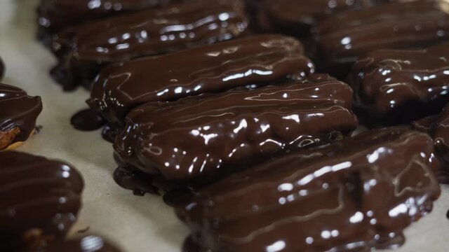 Bakery products. Eclair close-up covered with glaze