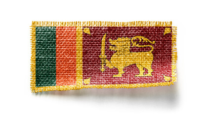 Sri Lanka flag on a piece of cloth on a white background