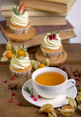 Autumn and winter baked pastries. Healthy muffins with traditional fall spices With tea cup. White marble table, copy space