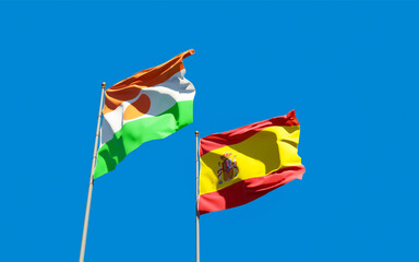 Flags of Niger and Spain.