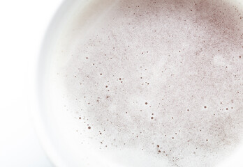 White foam in a mug with beer