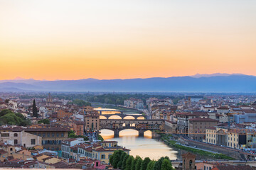 Fototapeta na wymiar Cityscape view at Florence in evening light with Ponte vecchio bridge over Arno river