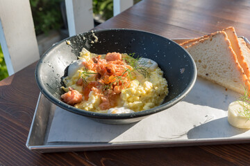 Scrambled eggs with salmon and chives