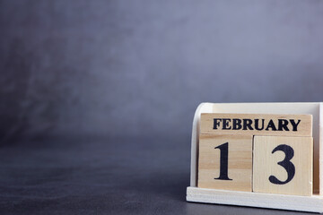 Day 13 of february month, Wooden calendar with date. Empty space for text.
