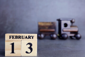 Day 13 of february month, Wooden calendar with date. Empty space for text.