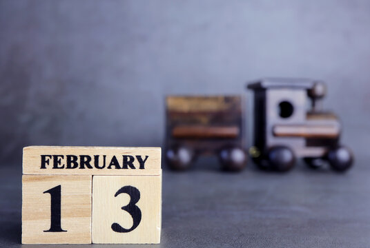 Day 13 of february month, Wooden calendar with date. Empty space for text. - Powered by Adobe
