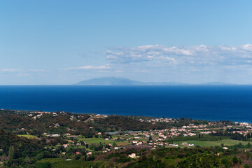 Fototapeta na wymiar Elba island and Moriani-plage village in the eastern coast of Corsica
