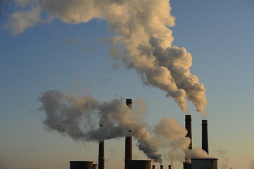 The chimney of a thermal power plant, the smoke extracted by a thermal power plant on the chimney,...