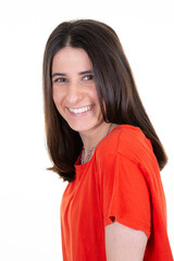 Portrait of smiling young woman wearing red shirt against white background