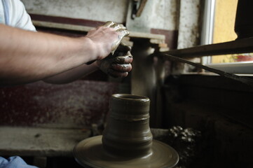 Handmade clay objects, raw, waiting to be decorated.