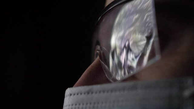 Head and Brain MRI Scan Analysed by Doctor Radiologist Wearing Glasses and Mask