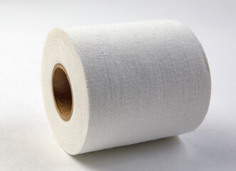 Medical sticking plaster roll on white. First aid item