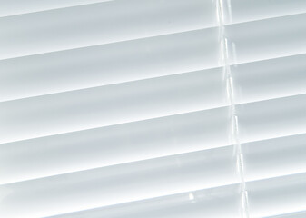 close white blinds close up on a sunny day