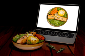 Grilled Salmon Salad, Lettuce, Grilled Corn, Carrot, Lemon, Rosemary. Find or learning cooking recipes from computer laptop via internet.