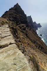 Huge cliff above the sea, towering mountains by the sea, elevated view of the distant horizon. Spain.