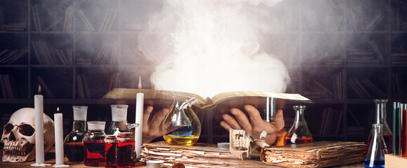 Woman with magic book on dark background