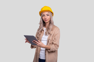 Girl Construction Worker Holding Tablet Watching Front Isolated. Girl Working with Tablet. Modern Construction, technology, Work concept