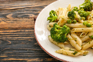 Tasty pasta with vegetables on wooden background, closeup
