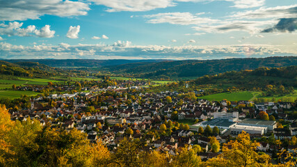 Germany, Aerial wide view above houses of city rudersberg in wieslauf valley surrounded by swabian...