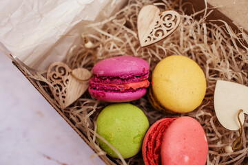Colorful macaroons in a gift box.Sweet macaroons as a gift. Top view