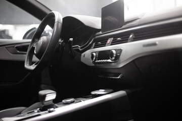 Fototapeta na wymiar interior of a modern car. Steering wheel, seat, radio, screen.