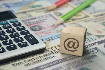 email address flat icon on wooden block cube with calculator and pencil on dollar bank note money, Business customer service and support online, Financial success concept