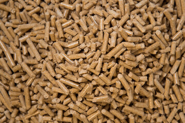 Wood litter for cat litter. Pellets close up. Green approach concept