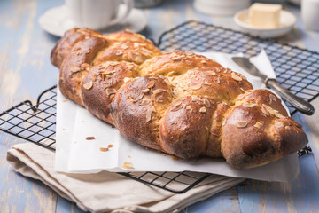 Tsoureki braid, greek easter sweet bread, on wood