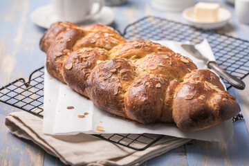 Tsoureki braid, greek easter sweet bread, on wood