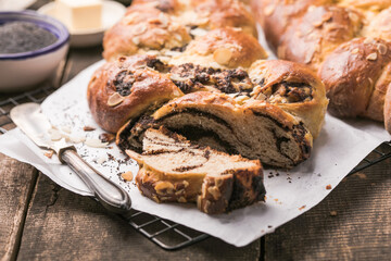 Tsoureki braid, greek easter sweet bread, on wood